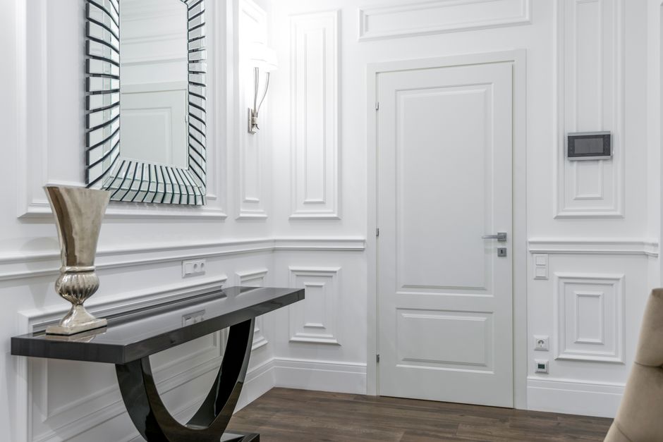Elegant white interior door with classic molding