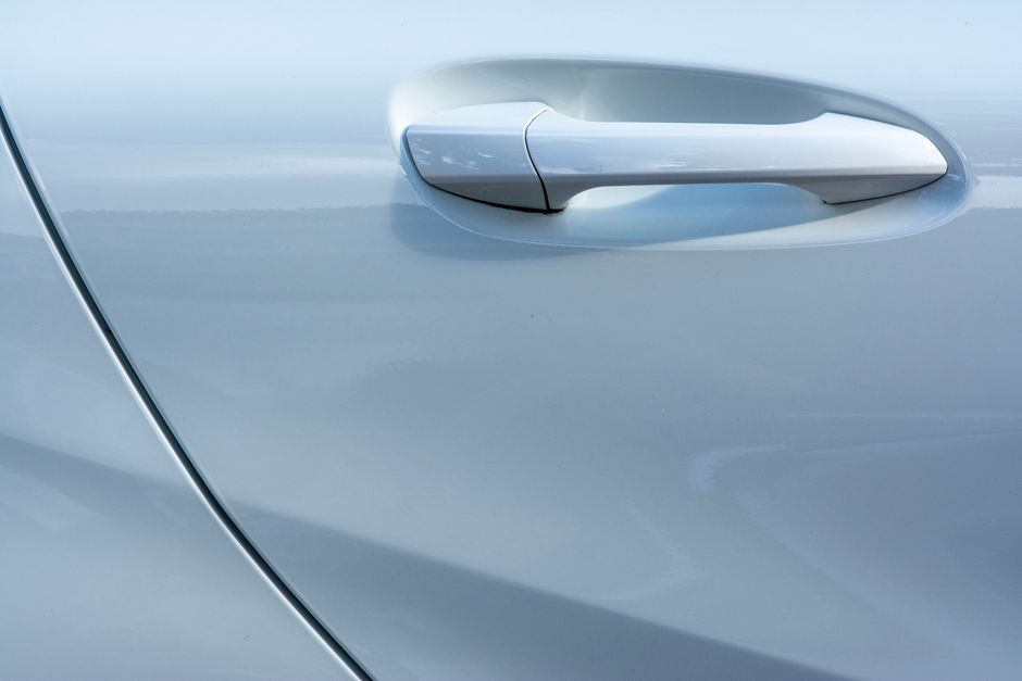 Closeup of a modern matte black door handle